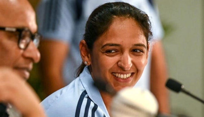 Star batter Harmanpreet Kaur smiles during press conference. —AFP/File