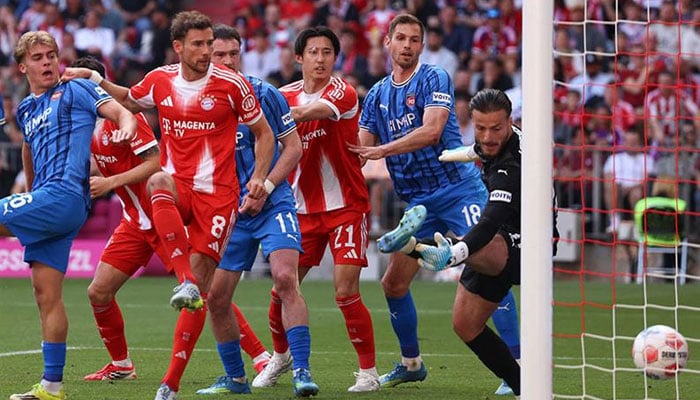 Bayern Munichs German midfielder Leon Goretzka (2L) scores his teams second goal during the German first division Bundesliga football match between FC Bayern Munich and Heidenheim in Munich. —AFP