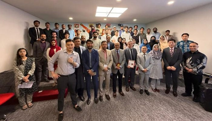 The image shows a group photo after an event. — Facebook@IIRIS/File