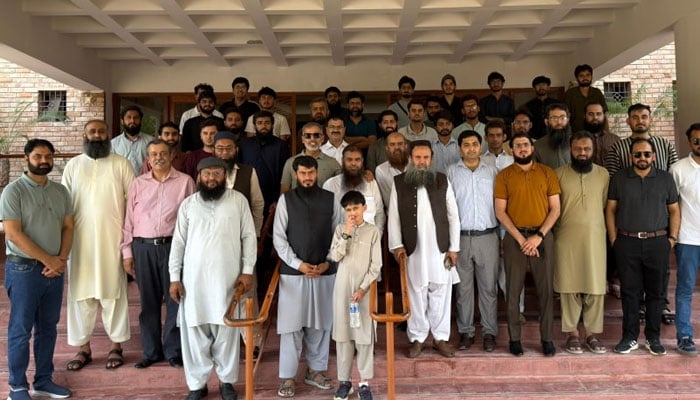 The image shows a group photo after the 16th Annual National Medical Conference in Karachi  on May 1, 2026. — Facebook@MMMPakofficial