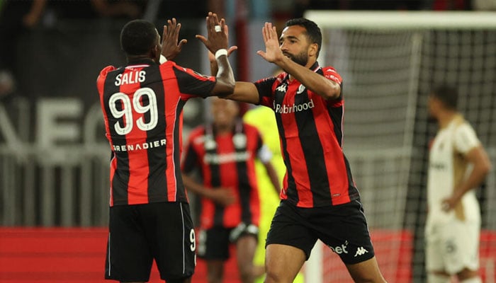 Ali Abdi (right), celebrating with Salis against Lens. —AFP