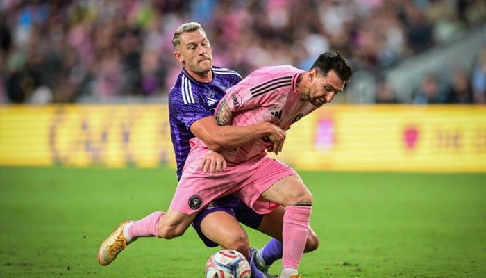 Inter Miamis Argentine forward, Lionel Messi, vies for the ball against Orlando Citys Swedish defender Robin Jansson. —AFP