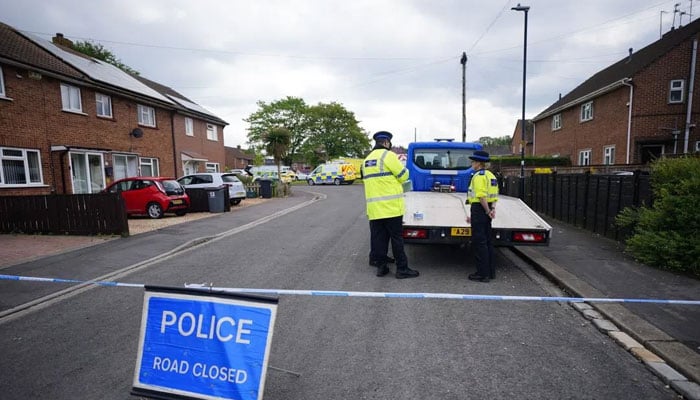 Emergency services at the scene, where two adults have died after an explosion at a house in the southern English city of Bristol, on May 3, 2026. — Reuters