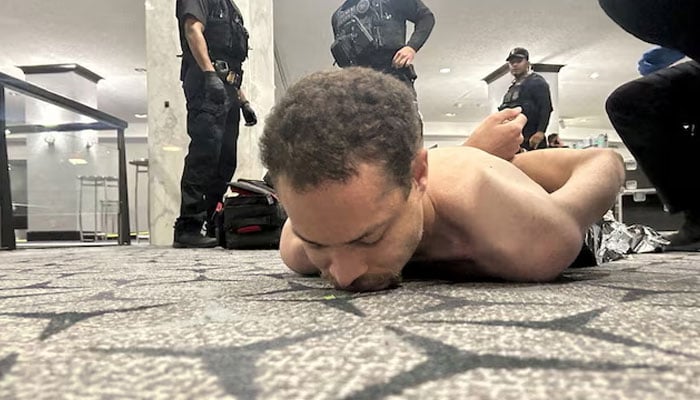 Law enforcement personnel detain Cole Tomas Allen, a suspect in the shooting incident at the White House Correspondents Association dinner, in Washington, DC, US April 25, 2026. — Reuters