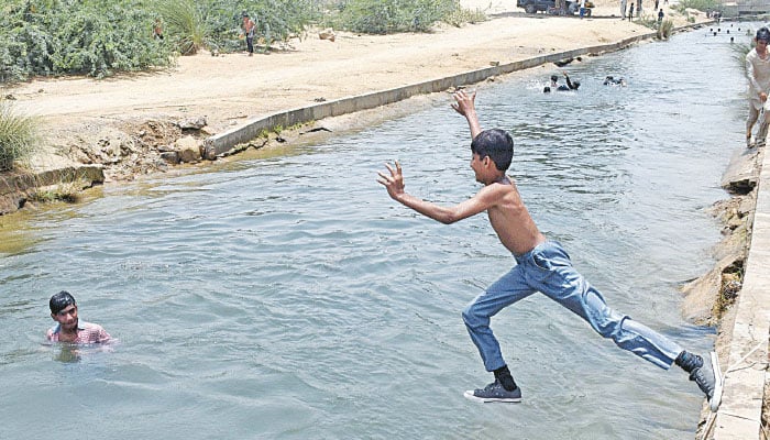 This representational image shows a boy jumps in the Hub Canal. — Online/File