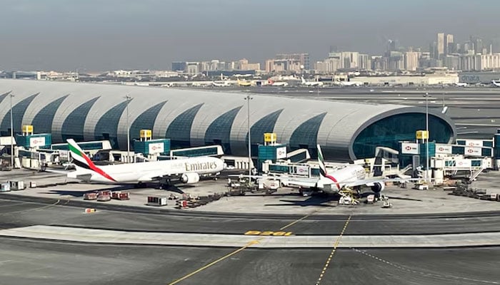 Emirates planes are seen on the tarmac in a general view of Dubai International Airport in Dubai, United Arab Emirates January 13, 2021. Picture taken through a window. — Reuters