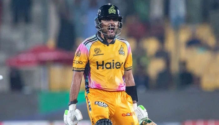 Peshawar Zalmis Babar Azam celebrates scoring his century during their PSL 11 Qualifier against Islamabad United at the National Bank Stadium in Karachi on April 28, 2026. — PSL