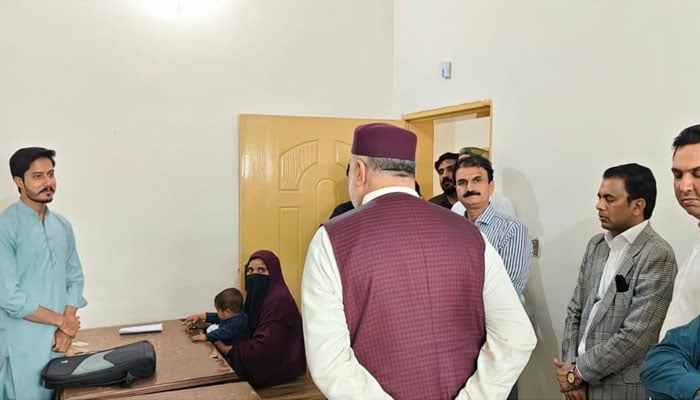 Federal Minister for Poverty Alleviation and Social Safety Syed Imran Ahmed Shah is seen at the Benazir Income Support Programme (BISP) office in Kasur on May 4, 2026. — PID
