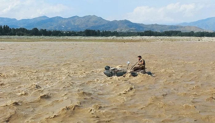 A rescue worker rows a raft while searching for survivors, after tourists, who were on a picnic, were swept away by overflowing floodwaters in the Swat River, in Swat Valley in Pakistan June 27, 2025. — Reuters