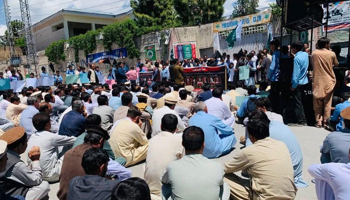The image shows a protest by teachers, students, and local residents outside the Parachinar Press Club to mark the third anniversary of the Teri Mangal school tragedy on May 4, 2026. — Facebook@PCRPress
