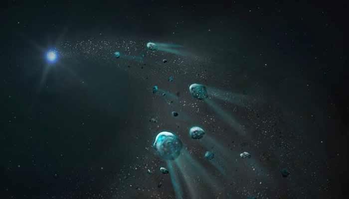 An early stage of an icy body being torn apart by the intense gravity of a white dwarf -a highly compact stellar ember- leaving glowing trails of gas and dust, as its fragments spiral inward, is seen in this handout illustration released on September 24, 2025.— Reuters/File