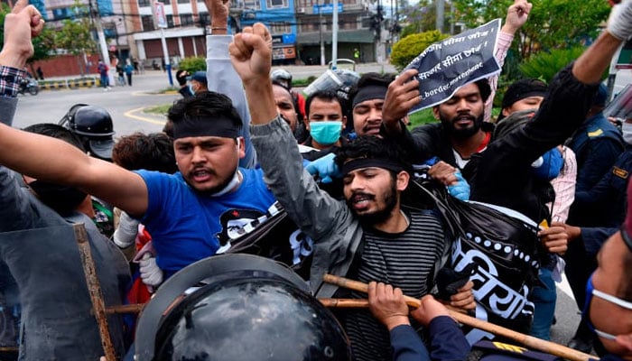 Police detain demonstrators during a protest against Indias newly inaugurated link road to the Chinese border, in Kathmandu. — AFP/File