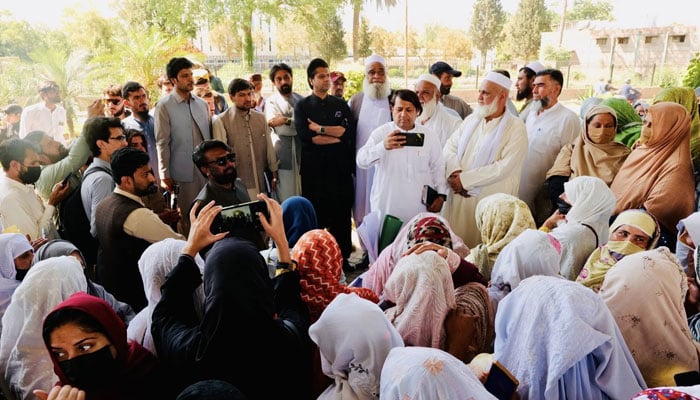 Special Assistant to the Chief Minister on Information and Public Relations, Shafiullah Jan is seen with Lady Health Workers on May 4, 2026. — Facebook@Shafijanpti
