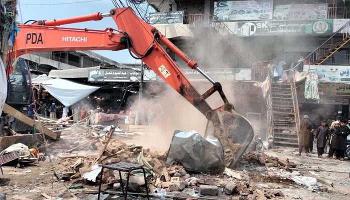 Anti-encroachment operation in progress removed illegal encroachment during anti encroachment drive under the supervision of district administration department in KP on August 19, 2024. — PPI
