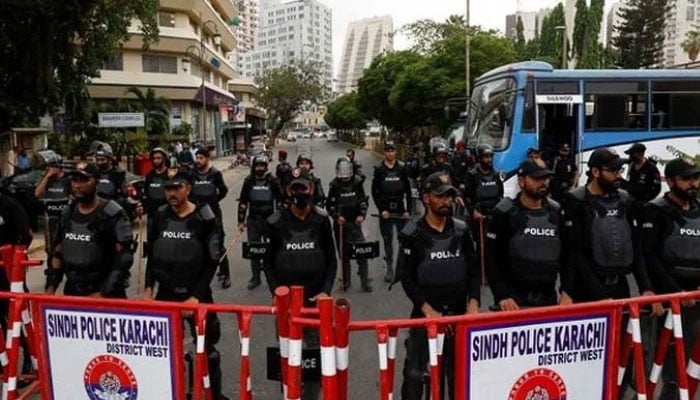 Sindh Police stand guard ahead of a protest in Karachi. — Reuters/File