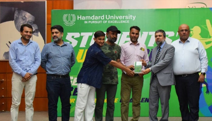 Hamdard University’s Vice Chancellor, Prof. Dr. Imran Amin, giving an award to a student. —Facebook@HamdardUniversityPK/File