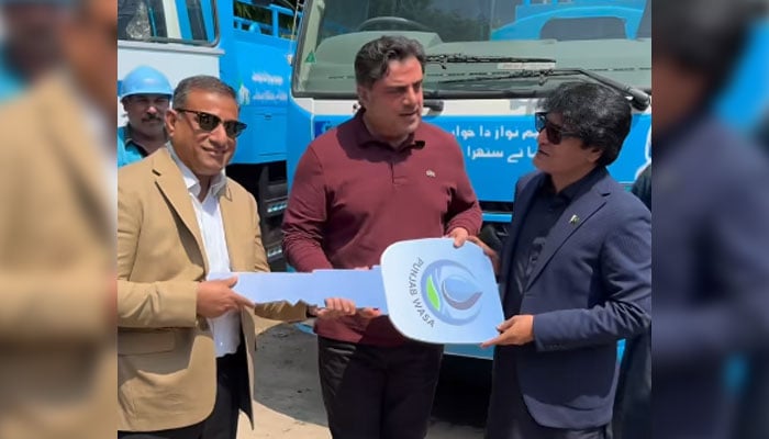 Provincial Minister for Housing and Urban Development, Bilal Yasin (centre), hands over symbolic vehicle keys to the Wasa DG Punjab on May 6, 2026. — Screengrab via Facebook@Bilal Yasin Official