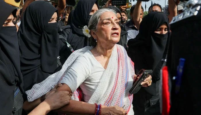 Women police officers detain Pakistani artist and human rights activist Sheema Kirmani, an organiser of the Aurat March, outside Karachi Press Club, where she was scheduled to address a press conference on May 5, 2026. — Reuters