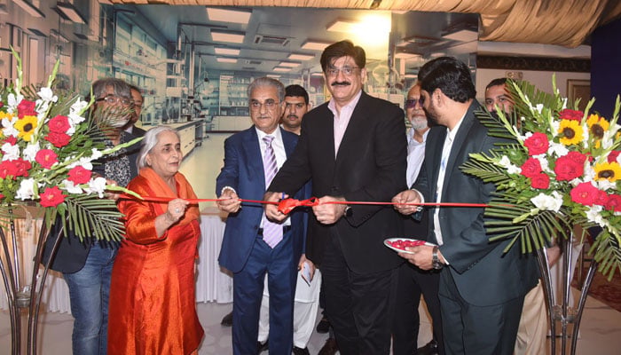 Sindh Chief Minister Syed Murad Ali Shah, with Health Minister Dr Azra Fazal Pechuho, Dr Fazalullah Pechuho, and others, cuts the ribbon to inaugurate Ultimi Research and Diagnostic Laboratory at a local hotel on May 6, 2026. — Facebook@SindhCMHouse