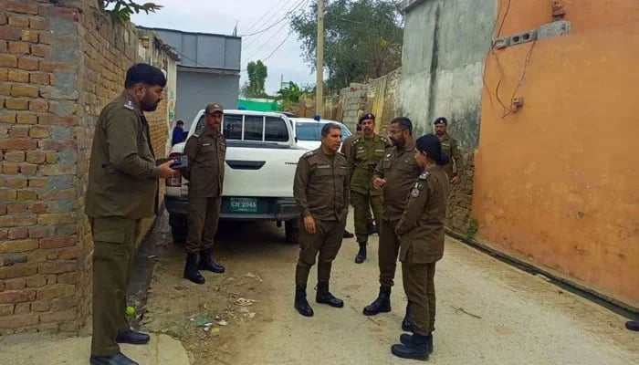 This image shows Rawalpindi Police officials interacting with each other on November 30, 2023. — Facebook@Rawalpindicpoofficeoffical