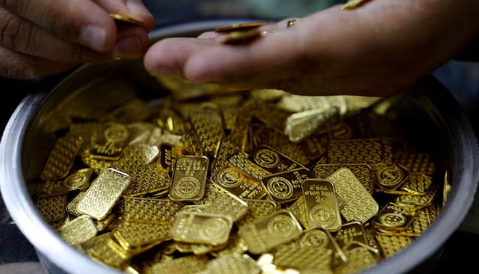 A jeweller holds gold bars in Cairo, Egypt, March 9, 2026. — Reuters