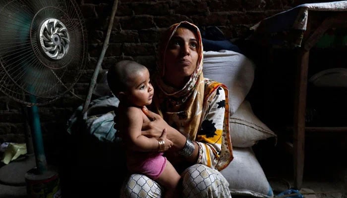 A mother holds her child in this undated image. — Reuters/File