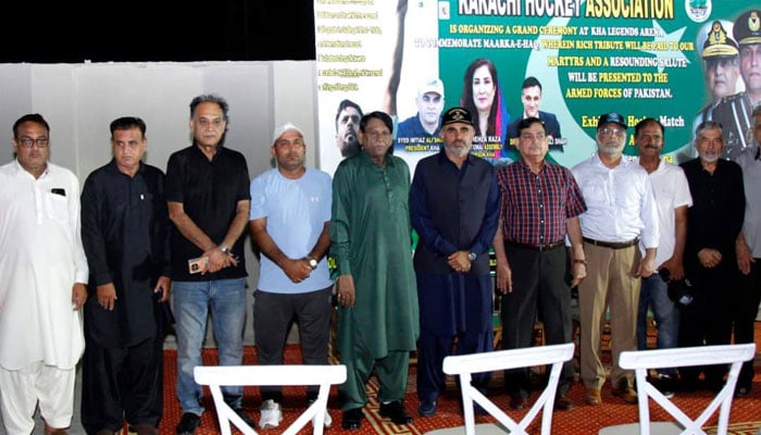 The image shows a group photo at an event organised by the Karachi Hockey Association (KHA) at KHA Legends Arena on May 9, 2026. — Facebook@KarachiHockeyOfficial