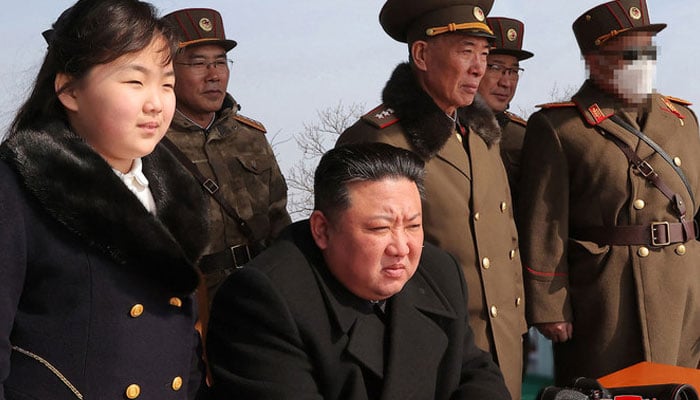 North Koreas leader Kim Jong Un and his daughter observing a warhead missile launch exercise simulating a tactical nuclear attack in Cheolsan county, 2023. — AFP