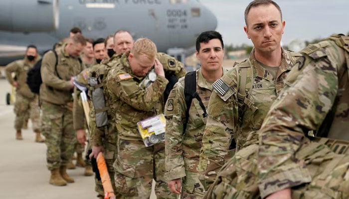 Military personnel from the 82nd Airborne Division and 18th Airborne Corps board a C-17 transport plane for deployment to Eastern Europe, amid escalating tensions between Ukraine and Russia, at Fort Bragg, North Carolina, U.S., February 3, 2022. — Reuters