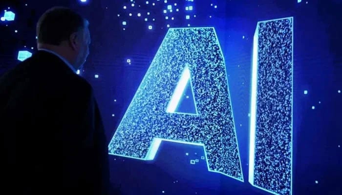 A visitor looks at an AI sign on an animated screen at Mobile World Congress, the telecommunications industry's largest annual gathering, in Barcelona. — AFP/File