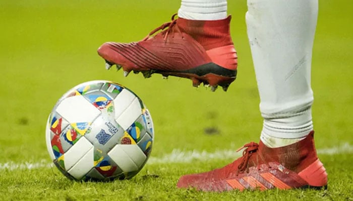 A player can be seen shooting the football. — AFP/File