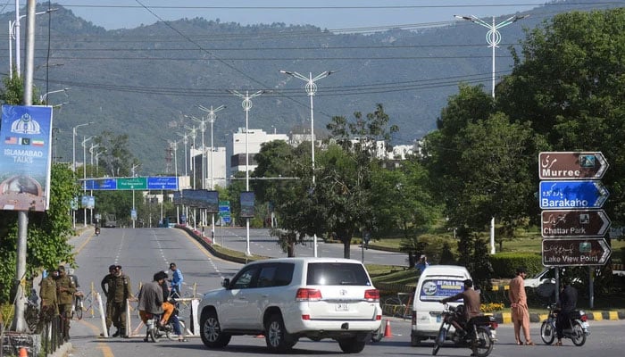 Security personnel check vehicles at a checkpoint near Serena Hotel following US and Iran peace talks in Islamabad on April 12, 2026. — Reuters