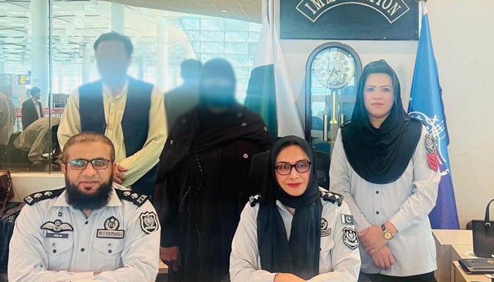 FIA Immigration officials pictured with Afghan nationals at Islamabad International Airport on May 10, 2026. — APP