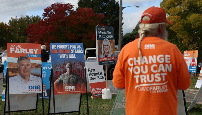 Campaign signs depicting One Nation candidate David Farley and former Australian soldier Ben Roberts-Smith are displayed outside a pre-polling centre ahead of the Farrer by-election in Albury, Australia, May 6, 2026.—Reuters