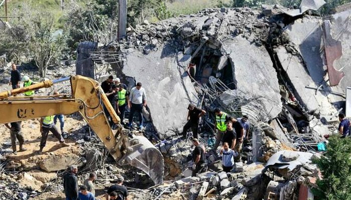 Rescue workers and residents search the rubble for victims at the site of an earlier Israeli airstrike in the southern village of Saksakieh on May 9, 2026. —AFP