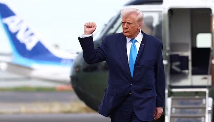 US President Donald Trump gestures as he walks from Marine One to board Air Force One to depart Haneda Airport for South Korea, in Tokyo, Japan, on October 29, 2025. — Reuters