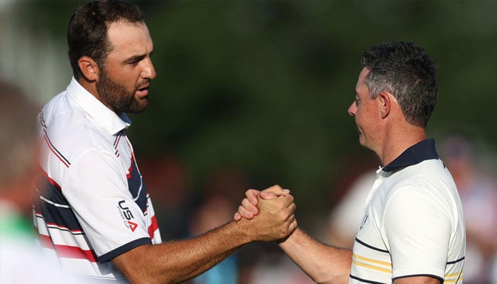 Top-ranked Scottie Scheffler (left) and world number two Rory McIlroy. —AFP