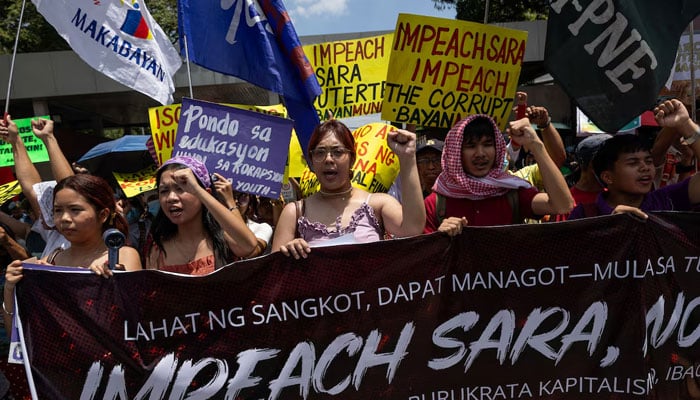 Protesters call for the impeachment of Philippine Vice President Sara Duterte ahead of a vote in the House of Representatives on whether to transmit the impeachment complaint to the Senate, outside the House of Representatives in Quezon City, Philippines, May 11, 2026.—Reuters
