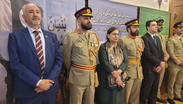 Ambassador Faisal Niaz Tirmizi (left) in a group photo during the celebration of the Marka-e-Haq at the Pakistan Embassy in Moscow on May 8, 2026. — Facebook@PakistanEmbassyMoscow