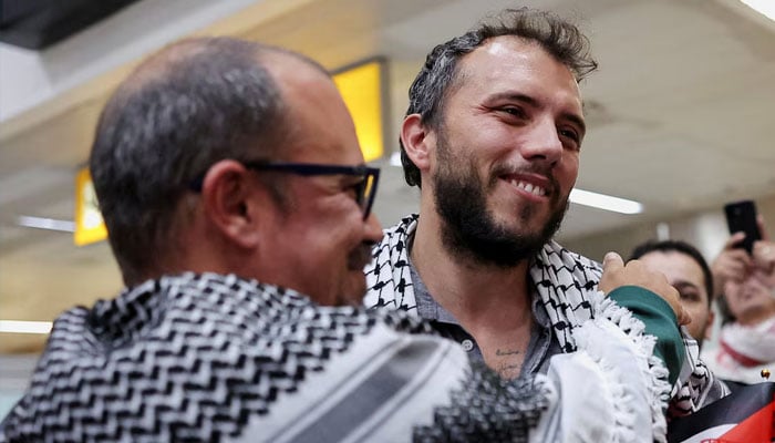 Brazilian activist Thiago Avila, who was detained aboard the Gaza-bound Global Sumud Flotilla, which was intercepted by Israeli forces, is embraced as he arrives at Sao Paulo/Guarulhos International Airport after being deported, in Guarulhos, Brazil, May 11, 2026.—Reuters