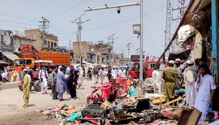 People and police officers in plain clothes gather after a blast at a market in Lakki Marwat, Khyber Pakhtunkhwa province, Pakistan, May 12, 2026.—Reuters