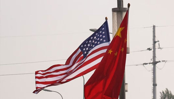National flags of China and the United States flutter on a road, ahead of the U.S. President Donald Trumps state visit to China, in Beijing, China, May 13, 2026.—Reuters
