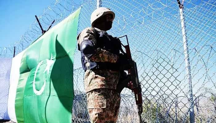 A soldier keeps vigil next to a border fence along with Afghanistan’s Paktika province border in Angoor Adda in South Waziristan on October 18, 2017. — AFP/File