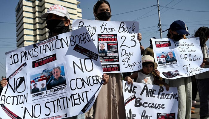Families of Pakistan´s crew members of an oil tanker seized by pirates in Somalia demonstrate during a protest near Karachi Port Trust (KPT) in Karachi on May 13, 2026. — AFP
