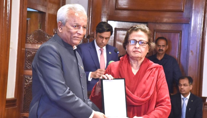 Sindh Governor, Syed Muhammad Nehal Hashmi, awards the Hilal-e-Imtiaz to Engineer Rukhsana Zubairi at the Governors House on May 13, 2026. — APP