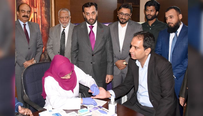 Federal Health Minister Syed Mustafa Kamal witnesses the HCV screening test during its soft launch at NIH, in the Federal Capital on May 13, 2026. — Online