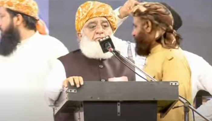 Jamiat Ulema-e-Islam-Fazl (JUI-F) chief Maulana Fazlur Rehman speaks at a Wahdat conference in Manghopir on May 14, 2026. — Screengrab via Facebook@MoulanaOfficial