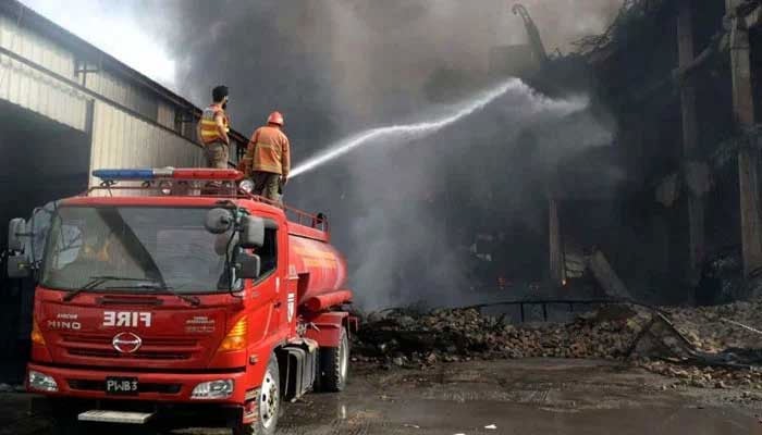 Representational image shows fire brigade officials extinguishing fire at a building. — PPI/File