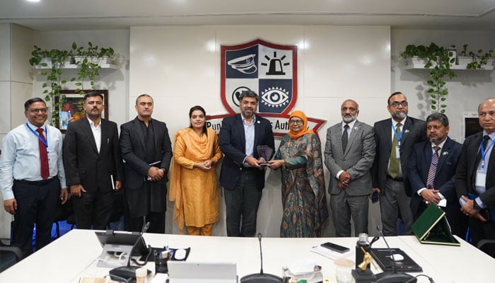An honorary shield being presented to the members of the Bangladeshi delegation by the PSCA.—APP