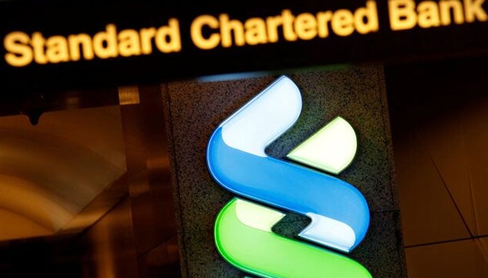 A logo of Standard Chartered is displayed at its main branch in Hong Kong, China, Aug. 1, 2017. — Reuters